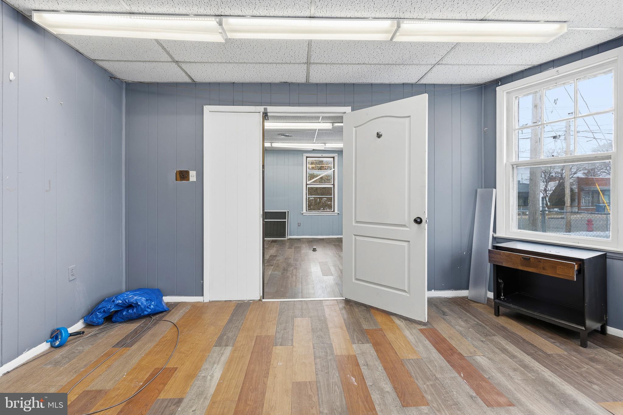 212 West Main Street Elkton, MD 21921 - Photo 5 of 35 a view of a livingroom with wooden floor and windows