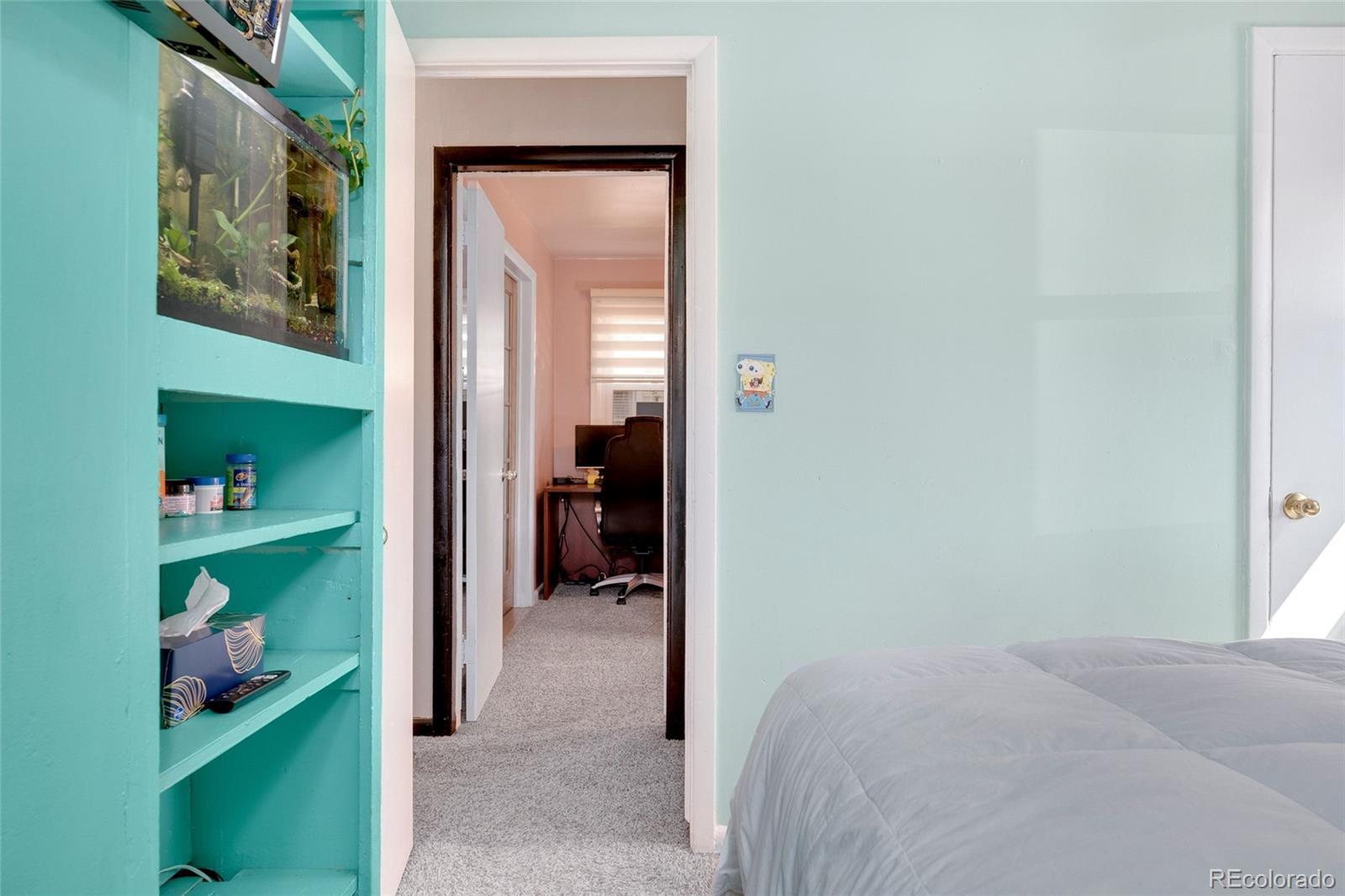 1530 Simms Street Lakewood, CO 80215 - Photo 16 of 38 a bed room with a bed and a closet