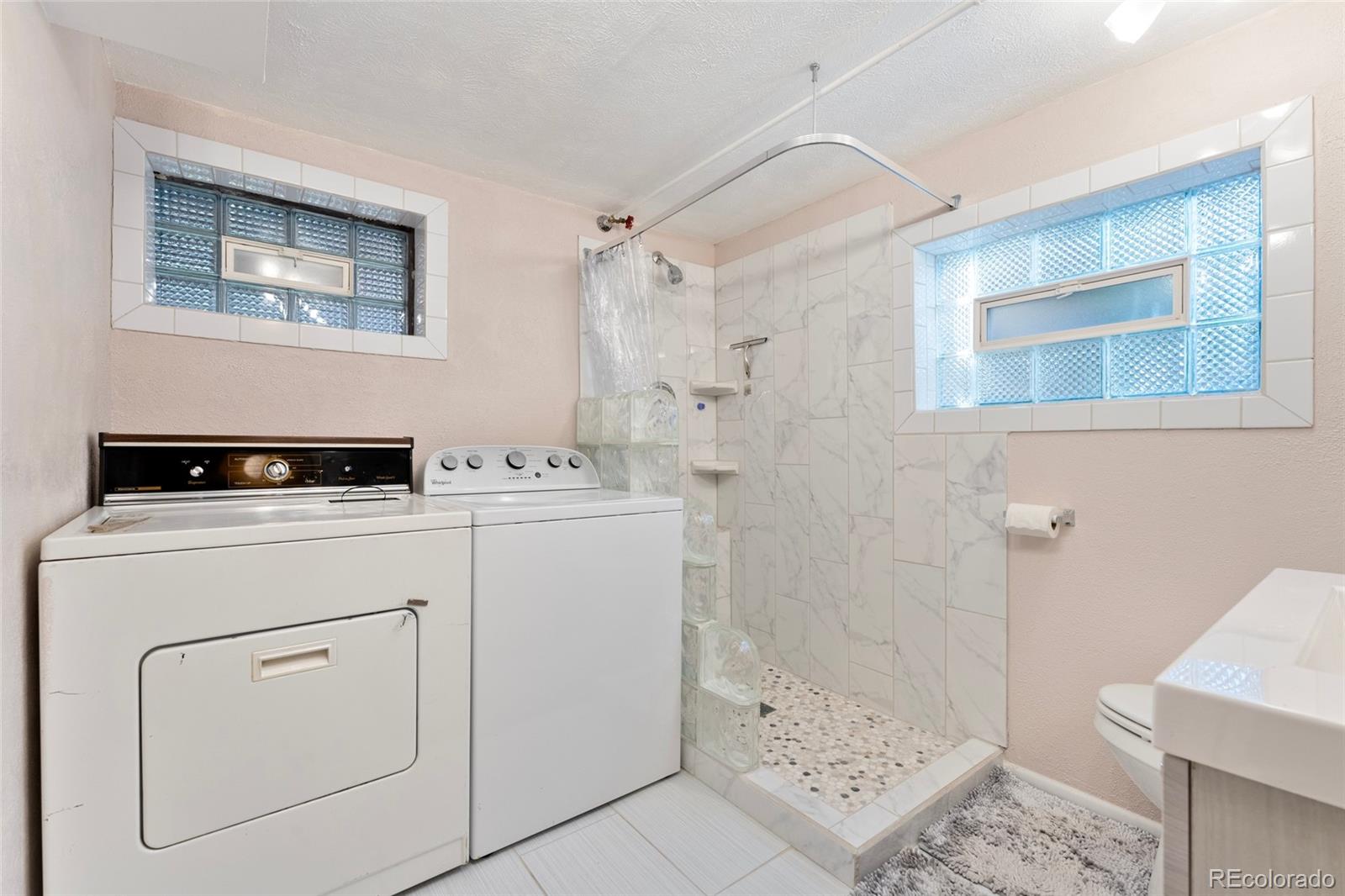 1530 Simms Street Lakewood, CO 80215 - Photo 18 of 38 a utility room with dryer and washer