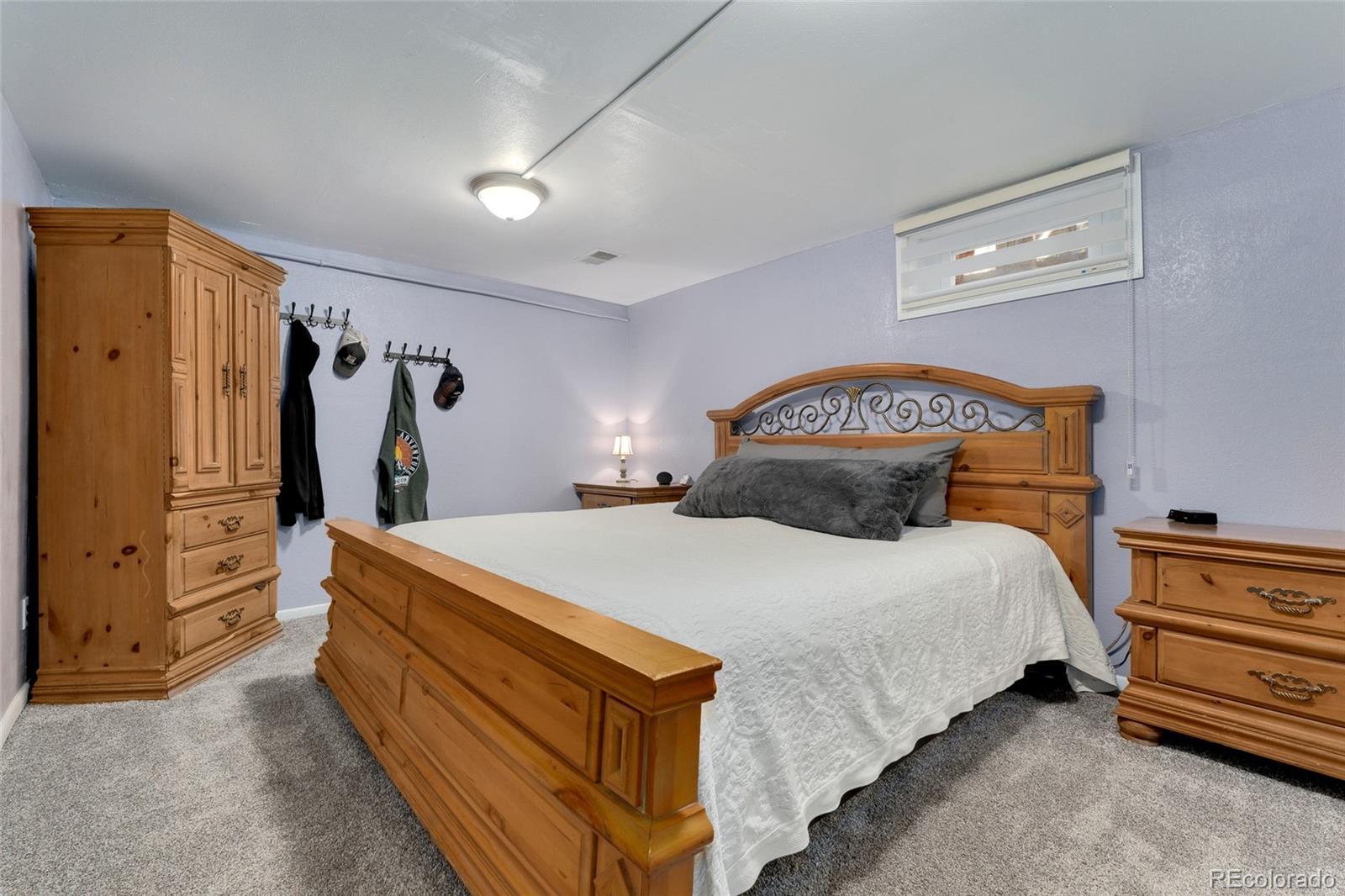 1530 Simms Street Lakewood, CO 80215 - Photo 24 of 38 a bedroom with a bed and a closet