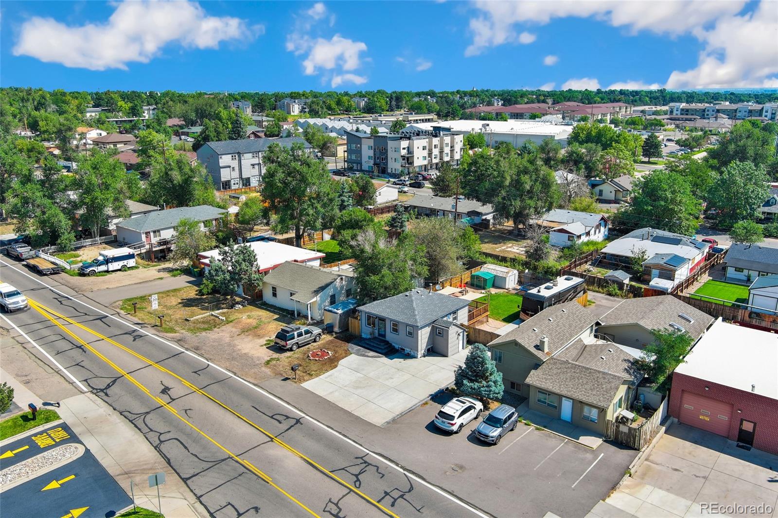 1530 Simms Street Lakewood, CO 80215 - Photo 33 of 38 a view of a terrace with lawn chairs and wooden floor