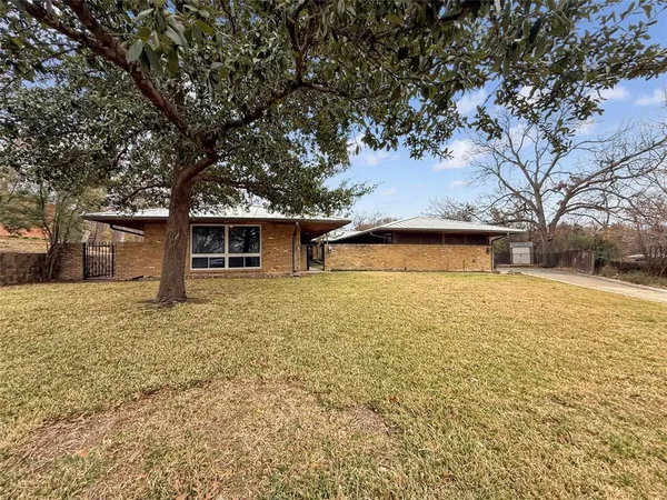 a house with trees in front of it