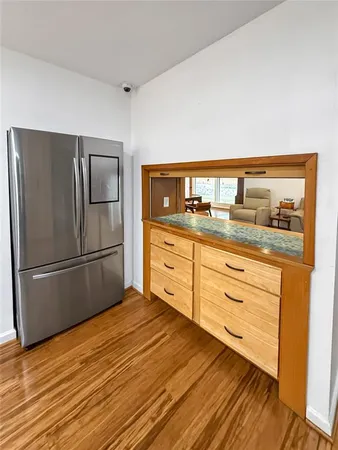 a kitchen with granite countertop cabinets and steel stainless steel appliances