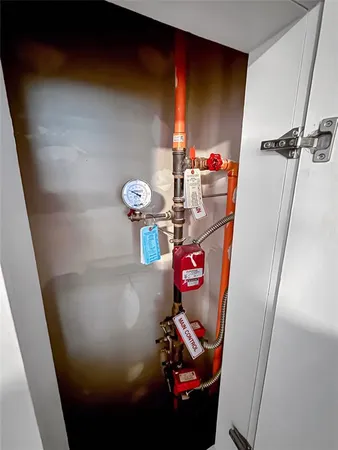 a view of a hallway with washer and dryer