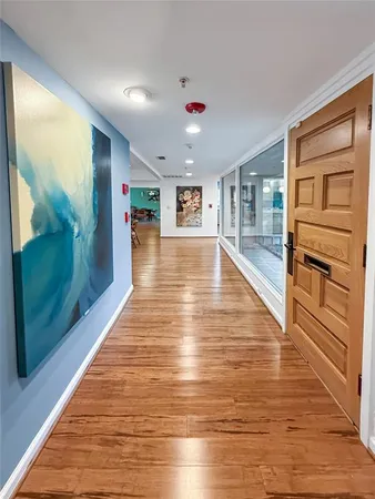 a view of a living room with hardwood floor