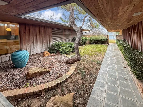 a view of a backyard of the house