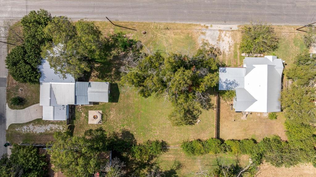 625 South Lillian Stephenville, TX 76401 - Photo 12 of 34 an aerial view of residential house with outdoor space and trees all around