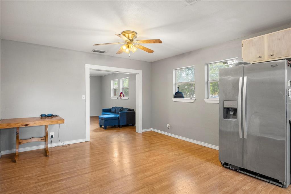 625 South Lillian Stephenville, TX 76401 - Photo 18 of 34 a view of an empty room with a window and wooden floor
