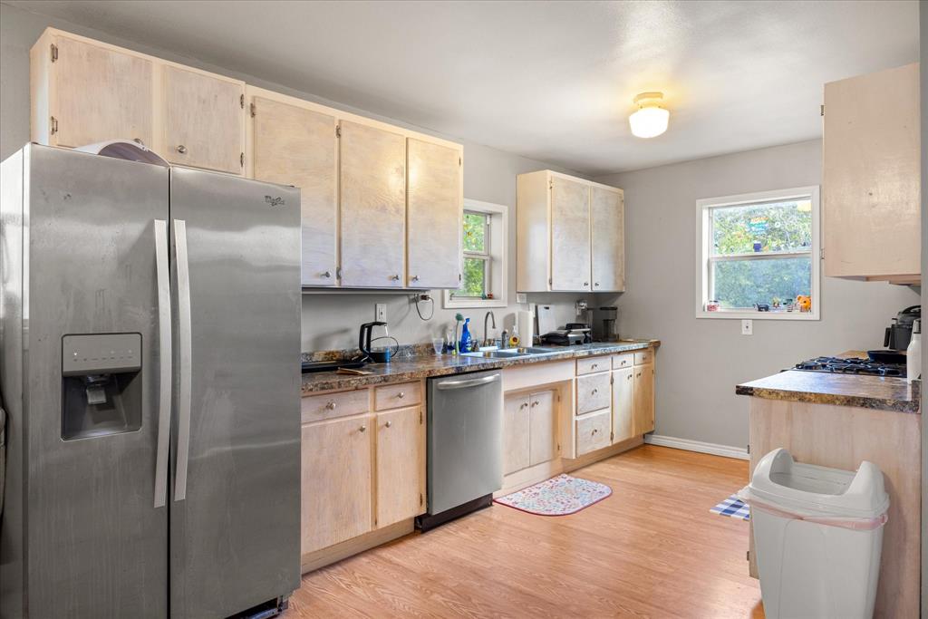 625 South Lillian Stephenville, TX 76401 - Photo 19 of 34 a kitchen with stainless steel appliances granite countertop a refrigerator sink and stove
