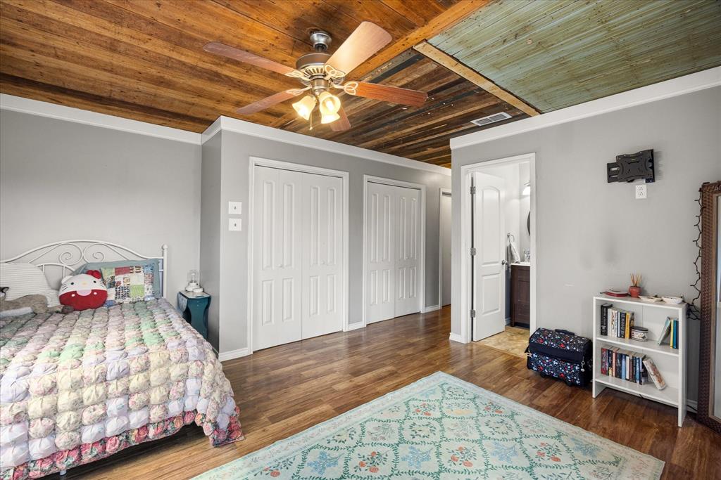 625 South Lillian Stephenville, TX 76401 - Photo 23 of 34 a bedroom with a bed and a dresser