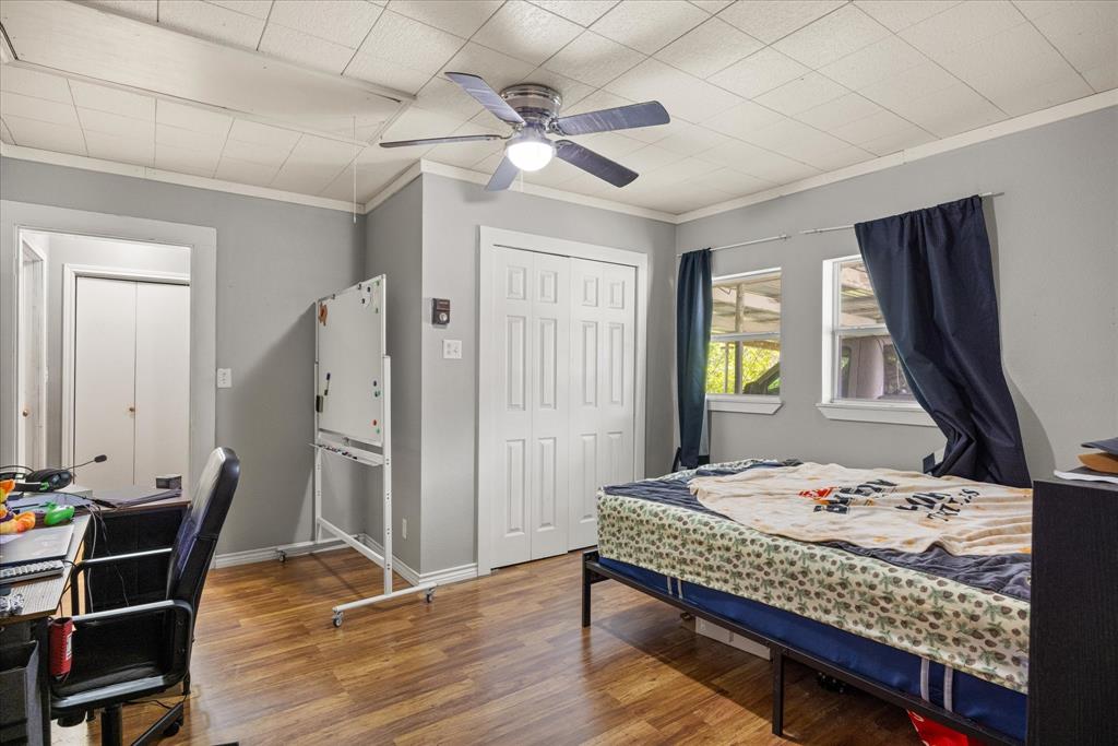625 South Lillian Stephenville, TX 76401 - Photo 25 of 34 a bedroom with a bed and a table in it