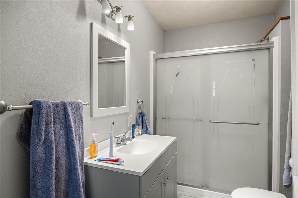 625 South Lillian Stephenville, TX 76401 - Photo 27 of 34 a bathroom with a sink toilet and shower