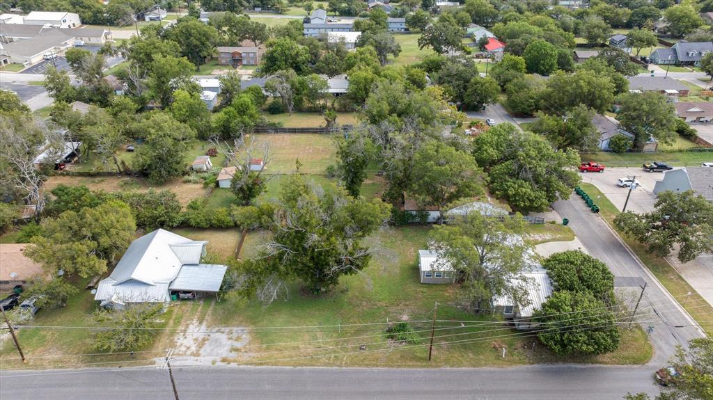 625 South Lillian Stephenville, TX 76401 - Photo 32 of 34 an aerial view of residential houses with outdoor space and swimming pool