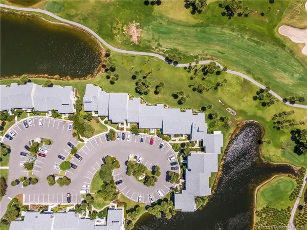 an aerial view of a houses with outdoor space