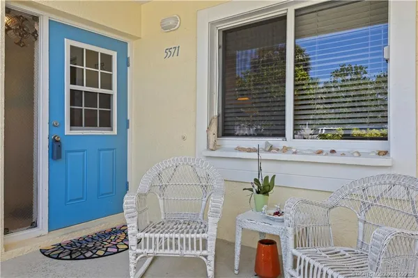 a view of a door and a window