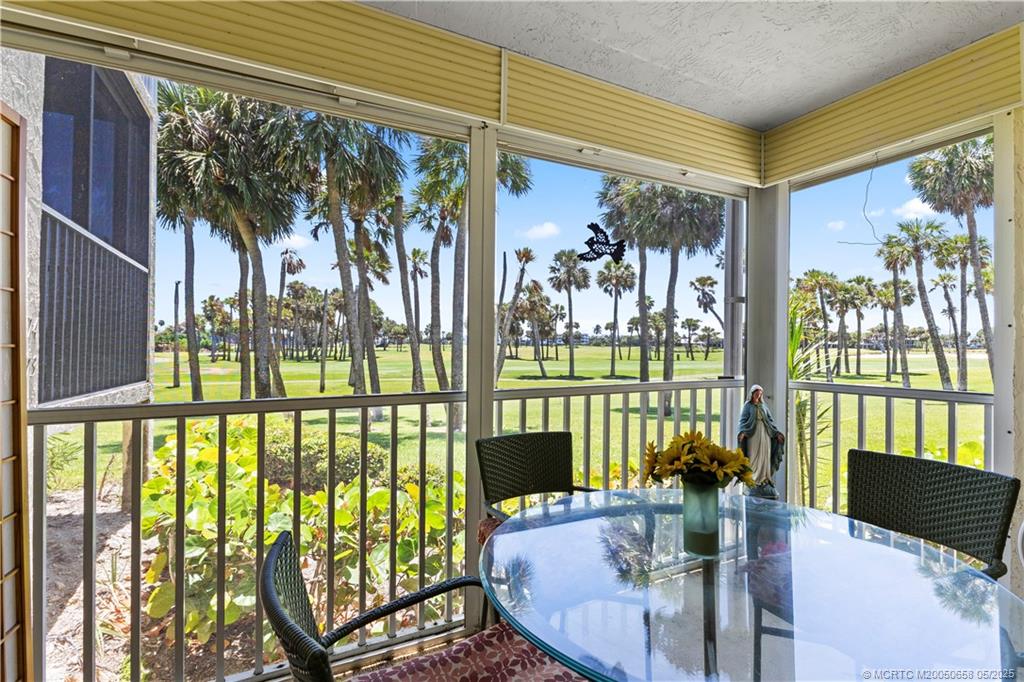 5571 Northeast Gulfstream Way Stuart, FL 34996 - Photo 19 of 40 a view of a dining room with furniture window and outside view