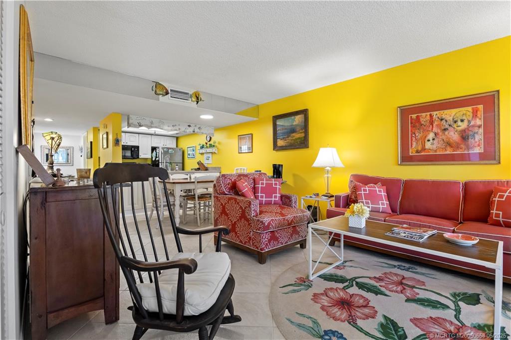 5571 Northeast Gulfstream Way Stuart, FL 34996 - Photo 20 of 40 a living room with furniture and a couch
