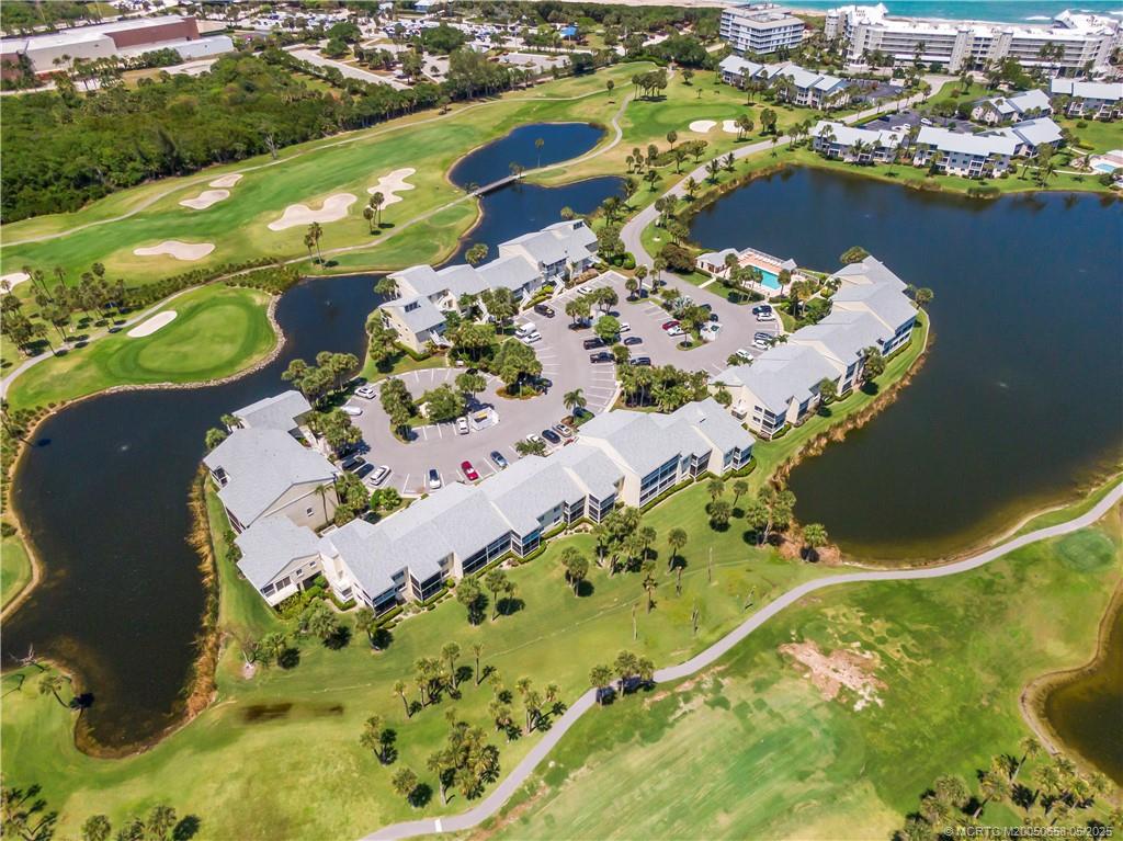 5571 Northeast Gulfstream Way Stuart, FL 34996 - Photo 35 of 40 an aerial view of a residential houses with swimming pool