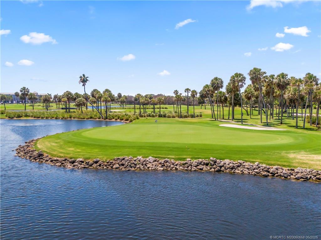 5571 Northeast Gulfstream Way Stuart, FL 34996 - Photo 37 of 40 a view of a golf course with a ocean view