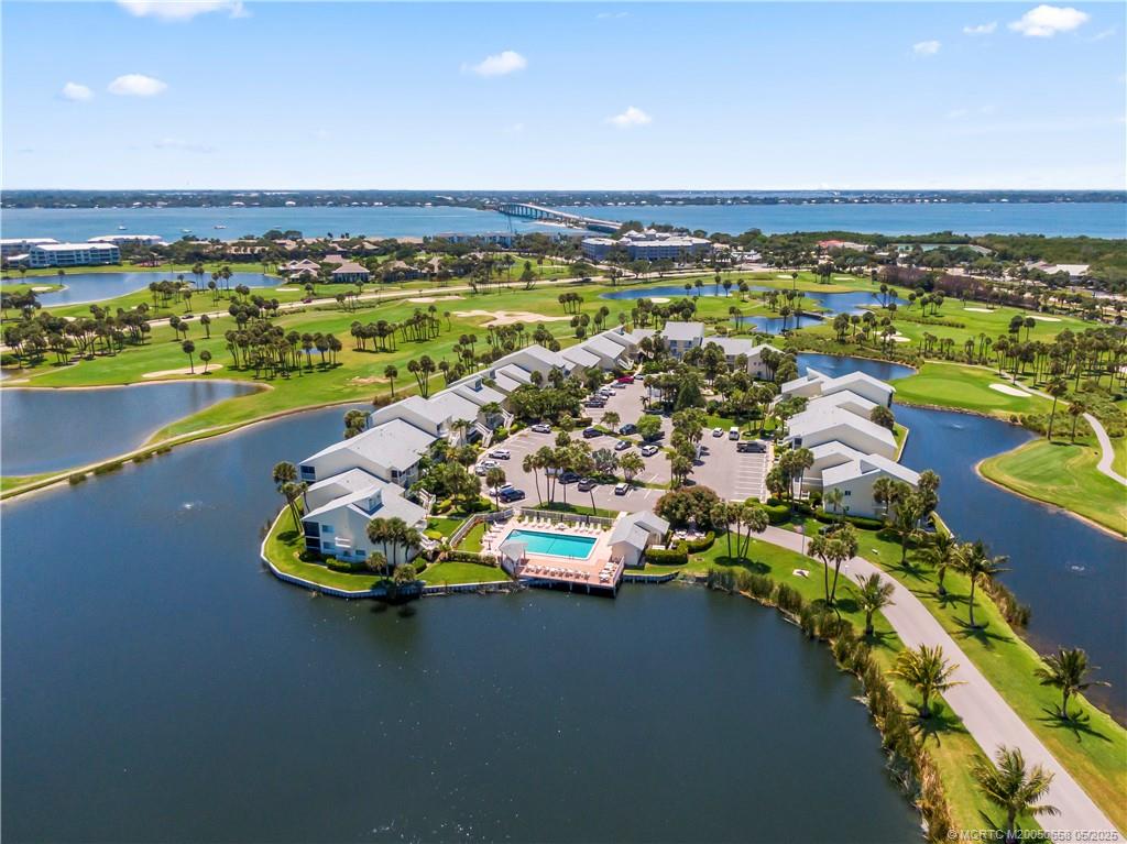 5571 Northeast Gulfstream Way Stuart, FL 34996 - Photo 5 of 40 a view of a swimming pool with an ocean view