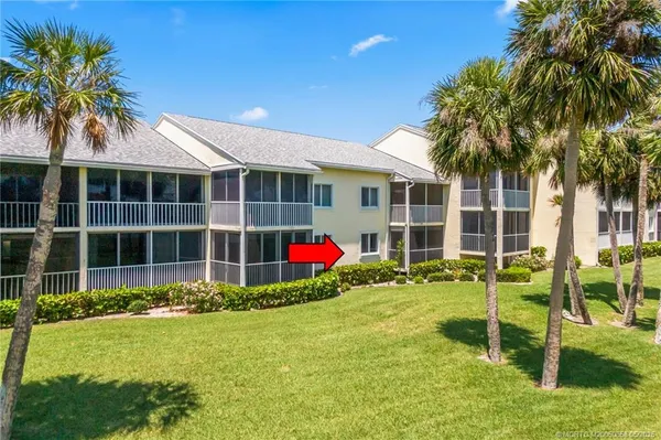 a view of a house with a backyard and a garden