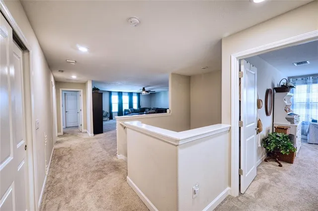 a view of livingroom with kitchen and entryway