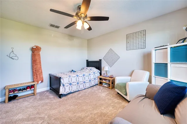 a bedroom with furniture and a chandelier