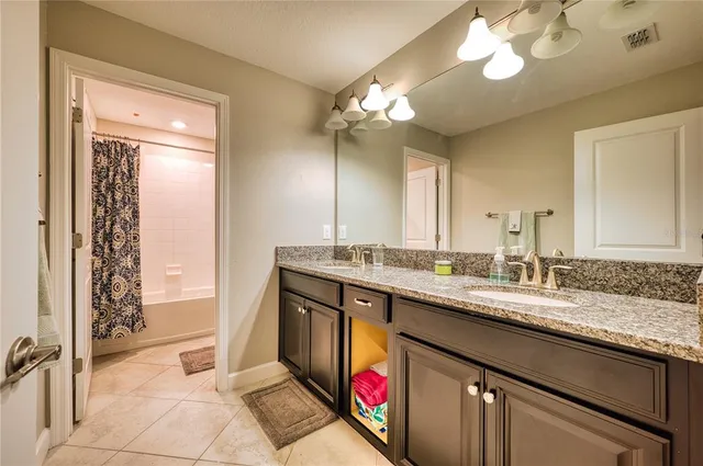 a bathroom with a sink a vanity and a mirror