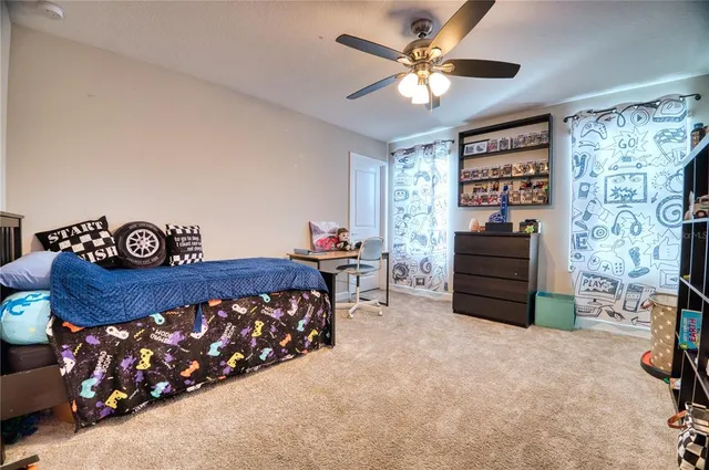a bedroom with a bed dresser and a window