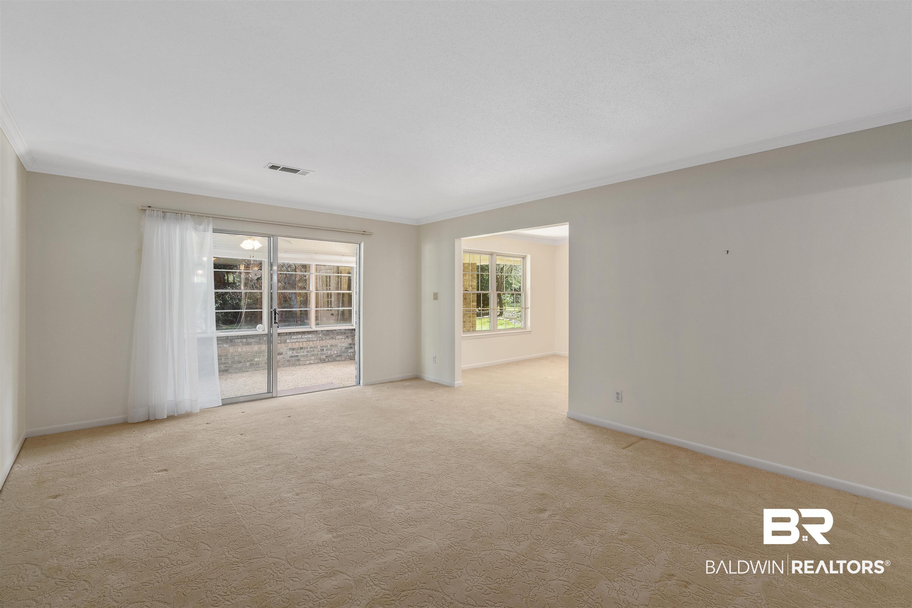 621 Spanish Main Spanish Fort, AL 36527 - Photo 19 of 29 Unfurnished room with light carpet and crown molding