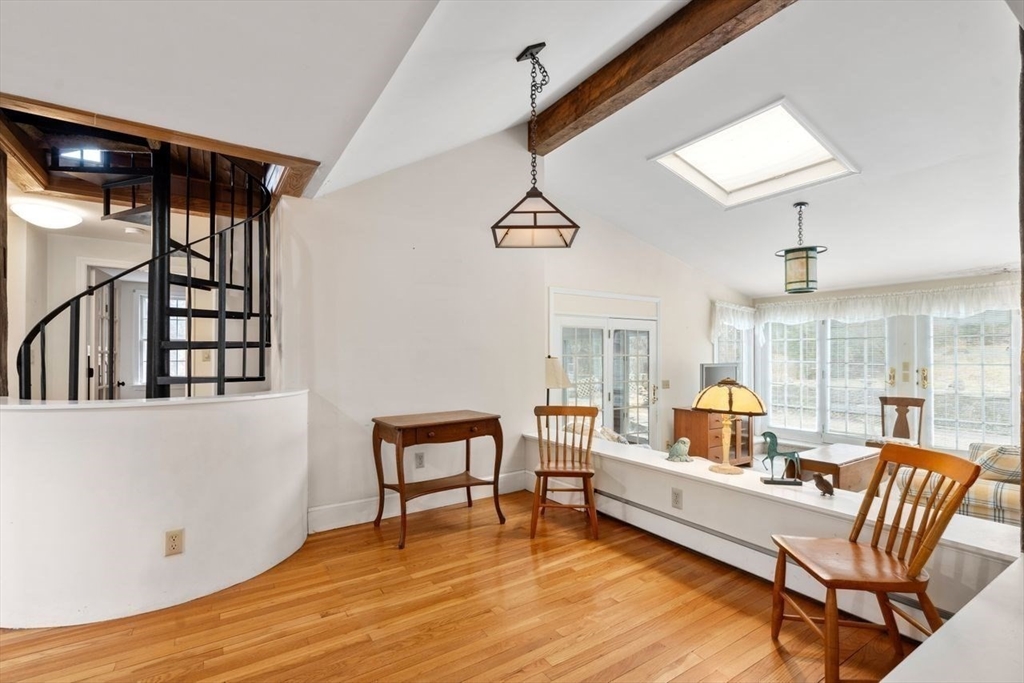 422 Liberty Square Road Boxborough, MA 01719 - Photo 12 of 39 a living room with furniture and a wooden floor