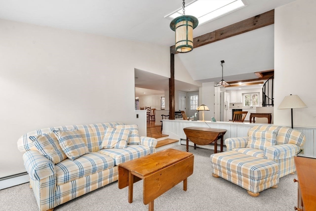 422 Liberty Square Road Boxborough, MA 01719 - Photo 13 of 39 a living room with furniture and a chandelier