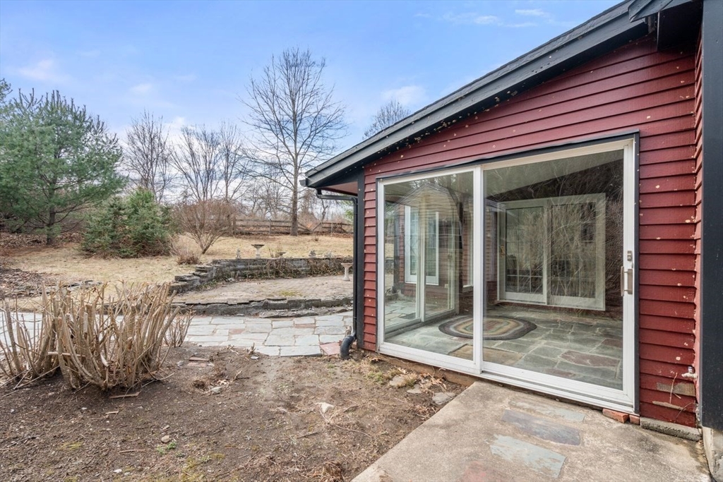 422 Liberty Square Road Boxborough, MA 01719 - Photo 25 of 39 a view of a house with a yard