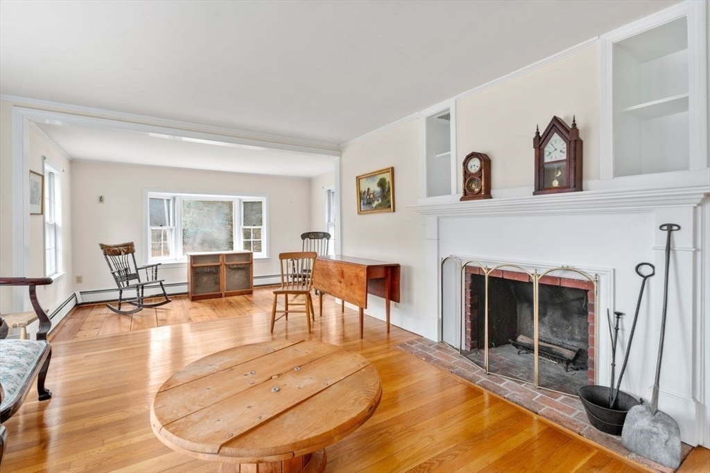 422 Liberty Square Road Boxborough, MA 01719 - Photo 3 of 39 a view of a livingroom with furniture and a fireplace