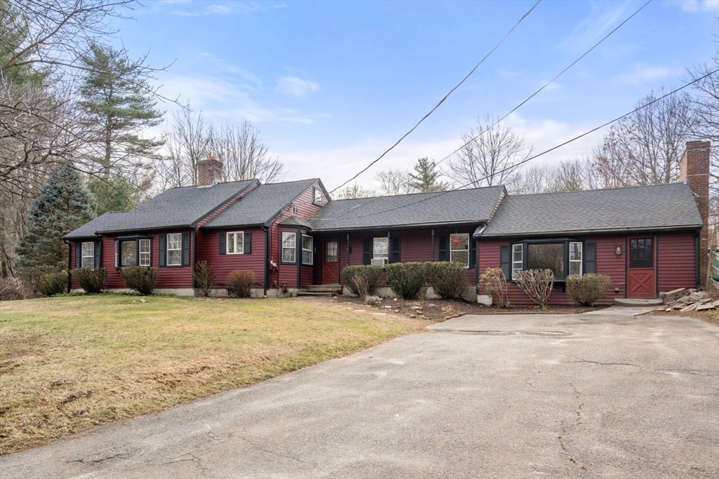 422 Liberty Square Road Boxborough, MA 01719 - Photo 32 of 39 a front view of a house with yard and porch