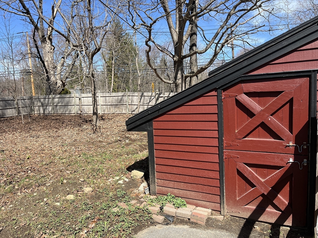422 Liberty Square Road Boxborough, MA 01719 - Photo 36 of 39 a backyard of a house with table and chairs