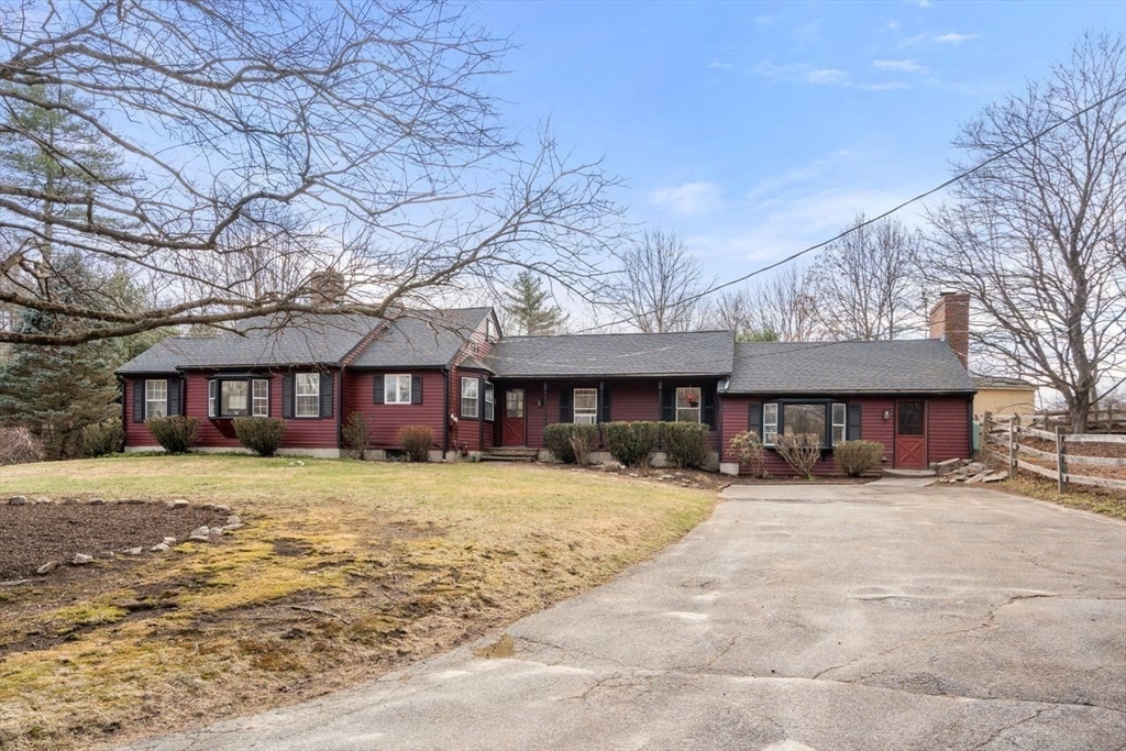 422 Liberty Square Road Boxborough, MA 01719 - Photo 5 of 39 a large house with a large tree in front of it