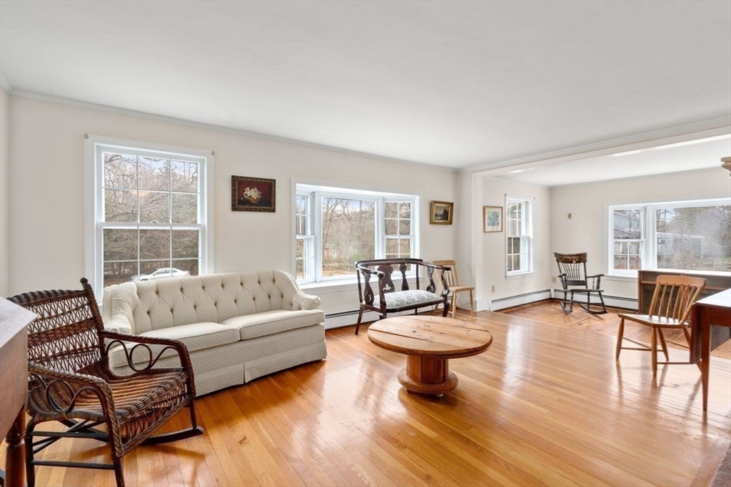 422 Liberty Square Road Boxborough, MA 01719 - Photo 6 of 39 a living room with furniture a table and a large window