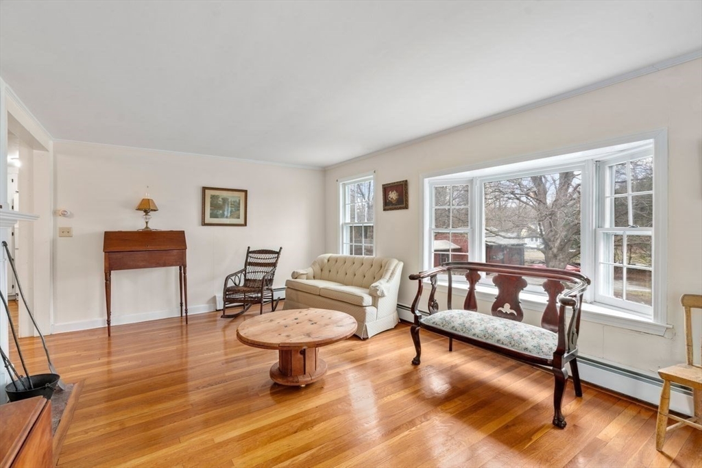 422 Liberty Square Road Boxborough, MA 01719 - Photo 7 of 39 a living room with furniture and a large window
