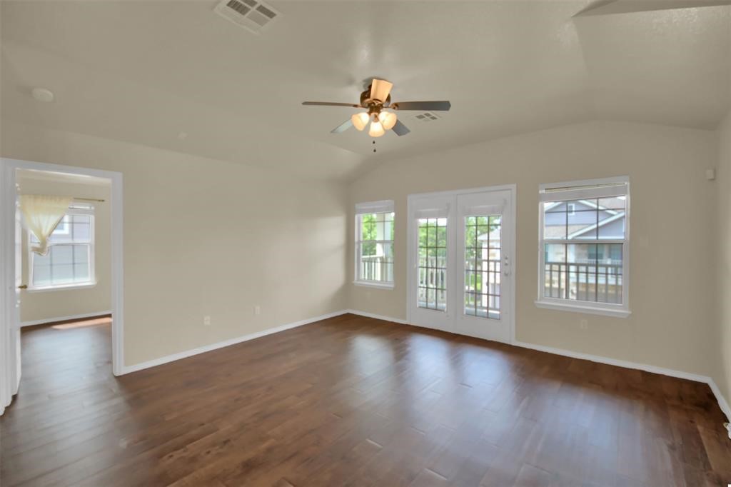 1900 Scofield Ridge Parkway, Unit 3401 Austin, TX 78727 - Photo 11 of 37 a view of empty room with wooden floor and fan