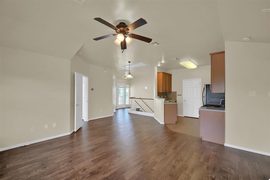 1900 Scofield Ridge Parkway, Unit 3401 Austin, TX 78727 - Photo 13 of 37 an open kitchen with white cabinets and stainless steel appliances