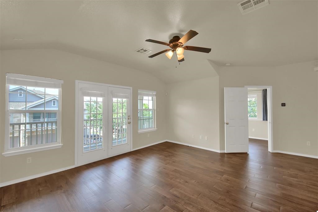 1900 Scofield Ridge Parkway, Unit 3401 Austin, TX 78727 - Photo 14 of 37 a view of an empty room with wooden floor and a window