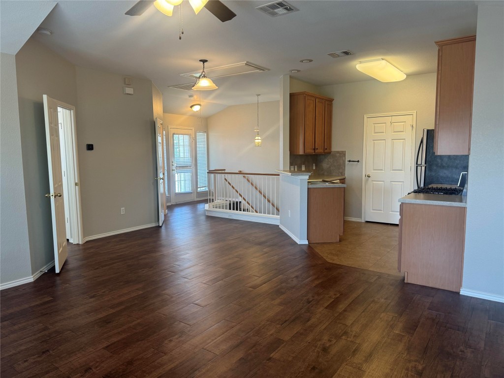 1900 Scofield Ridge Parkway, Unit 3401 Austin, TX 78727 - Photo 15 of 37 an open kitchen with a refrigerator and a stove top oven