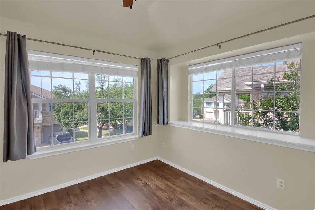 1900 Scofield Ridge Parkway, Unit 3401 Austin, TX 78727 - Photo 22 of 37 a view of empty room with wooden floor and fan