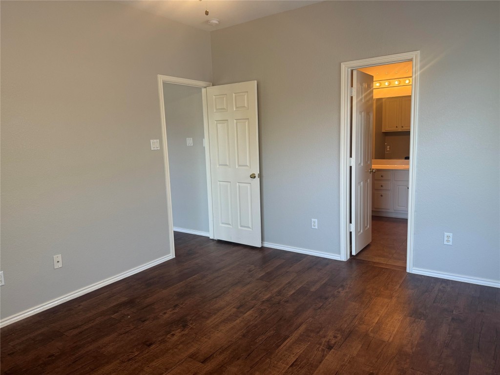 1900 Scofield Ridge Parkway, Unit 3401 Austin, TX 78727 - Photo 26 of 37 an empty room with wooden floor and closet