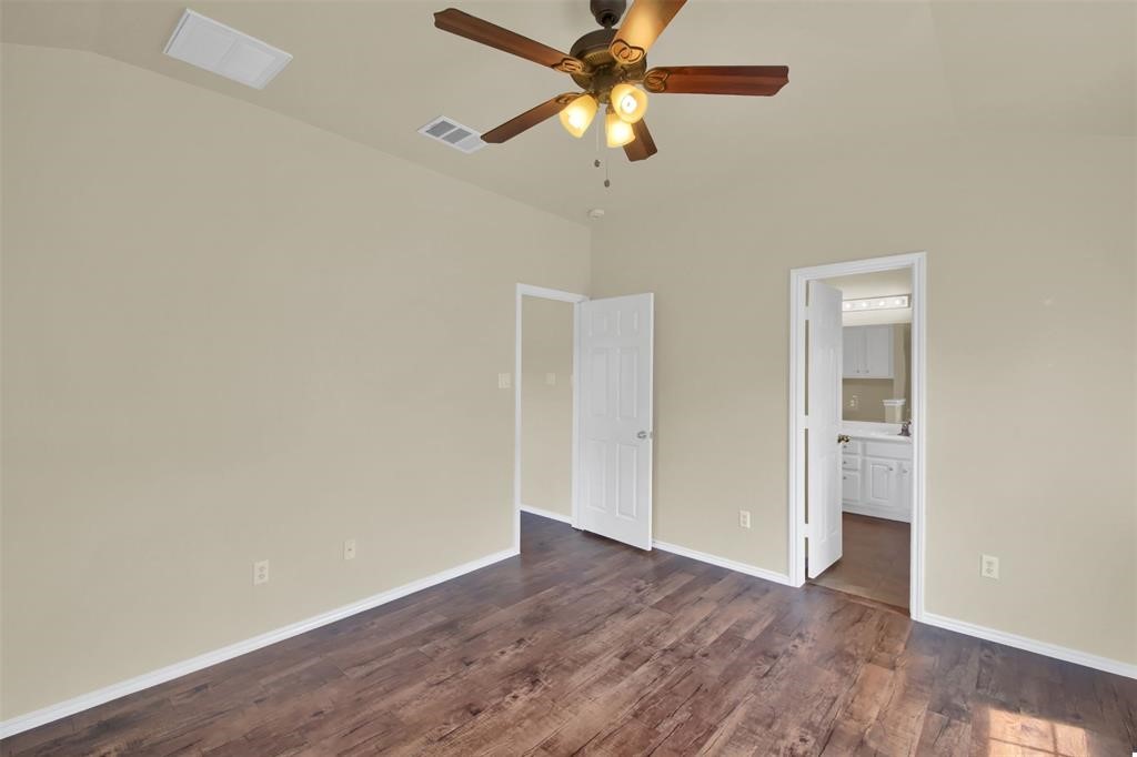 1900 Scofield Ridge Parkway, Unit 3401 Austin, TX 78727 - Photo 27 of 37 an empty room with wooden floor fan and windows