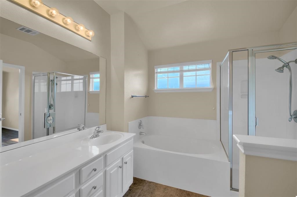 1900 Scofield Ridge Parkway, Unit 3401 Austin, TX 78727 - Photo 31 of 37 a bathroom with a tub sink and mirror