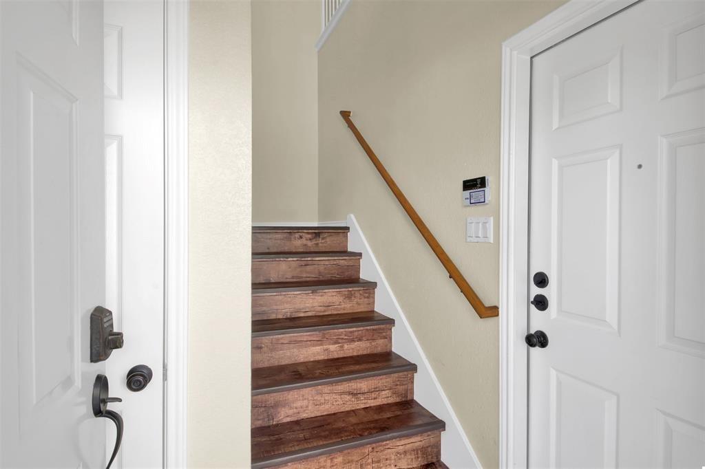 1900 Scofield Ridge Parkway, Unit 3401 Austin, TX 78727 - Photo 4 of 37 a view of a hallway with wooden floor and staircase