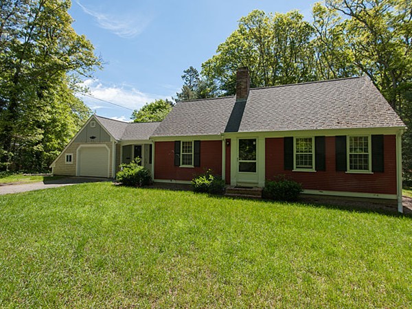 95 Holly Hill Road Barnstable, MA 02632 - Photo 2 of 16 a front view of a house with a garden