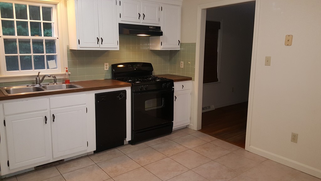 95 Holly Hill Road Barnstable, MA 02632 - Photo 7 of 16 a kitchen with a sink and cabinets